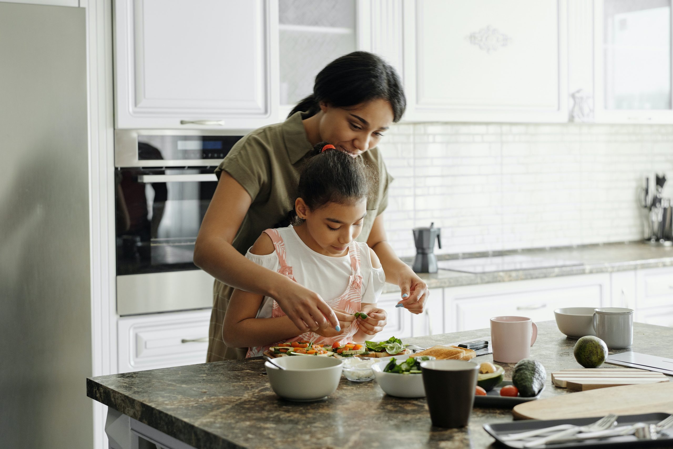 mother daughter preparing nutritious meal